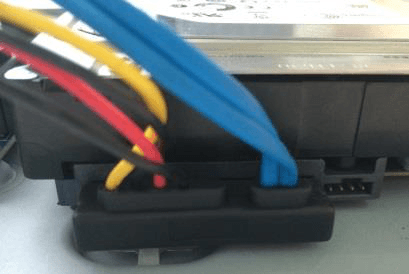 HDD data cable and power cable connected between the HDD and the mainboard