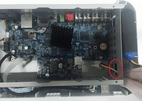 Battery cable pulled through the hole in the mainboard mounting area