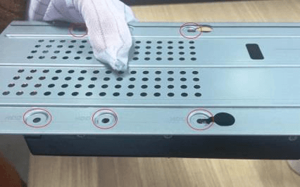 Bracket holes aligned with the screw holes on the HDD