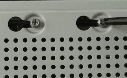 Device turned over to align and fix the HDD screws through the holes on the back