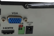 Rear of the chassis with a screwdriver loosening the cover screws near the VGA, audio and DC 12V ports