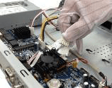 Hand connecting the data and power cables to the mainboard