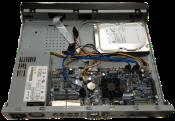 HDD placed inside the 1U chassis over the four mounting holes