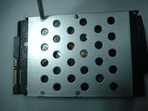HDD secured in its mounting bracket with four screws